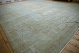 Distressed Mahal rug corner view, showing textured foundation and pale beige-blue pile.