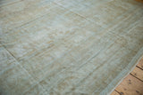 Distressed Mahal carpet texture showing foundation, with muted beige, sand, pale blue.