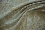 Distressed texture of the vintage Mahal rug, revealing sandy beige and pale blue foundation.