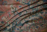 Distressed vintage Persian Mahal carpet with rose, teal, and beige scrolling floral motifs.
