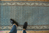 Distressed vintage Mir Sarouk runner: pale blue field with boteh motifs and geometric Serbend border.