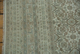 Detail of Indian Bijar carpet: Herati motif, striped pattern, even wear, ivory, slate blue, and fringe.