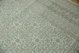 Hand-knotted Indian Bijar rug detail: Herati pattern and geometric border in muted ivory, slate blue, and dusty beige.