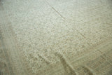 Vintage Indian Bijar carpet, close-up of Herati design, with subtle abrashes in faded neutral tones.