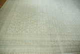 Hand-knotted Indian Bijar border and Herati field in muted ivory, dusty beige, and slate blue.