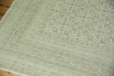 Corner of the vintage Indian Bijar design carpet, showing faded Herati motifs in ivory and slate blue.