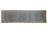 Vintage distressed Persian Hamadan runner with a triple column floral pattern in blue and terracotta.