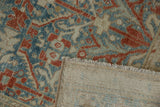 Detailed corner view of a vintage Hamadan rug revealing its hand-knotted foundation.