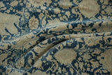 Flowing folds showcase distressed blue and ivory Safavid-inspired floral motifs.