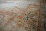 Amritsar corner shows worn Herati pattern, terra cotta and dusty teal samovar border.