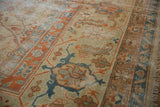 Vintage Amritsar rug detail: Herati pattern, samovar border, terra cotta, dusty teal, worn texture.