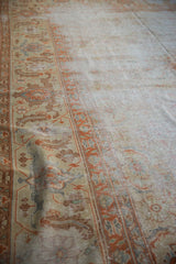 Vintage Amritsar carpet detail: worn Herati field and samovar sickle leaf border in terra cotta.