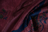 Velvety dusty raspberry pile and indigo ribbon motifs on a vintage Nichols Art Deco carpet.