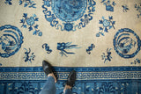 Antique Chinese Ningxia rug border detail featuring a blue Greek key motif on beige.