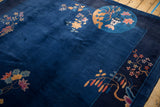 Corner detail of vintage Nichols Art Deco rug, raspberry lotus flowers and gold blossoms.