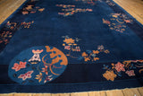 Nichols Art Deco pictorial carpet with a cobalt blue ground and raspberry vase motif.