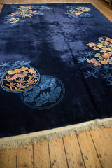 Pale, textured fringe at the end of the deep navy blue Art Deco rug.