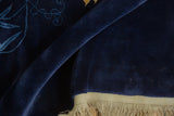 Plush navy blue pile and original beige fringe of a vintage Chinese Art Deco rug.