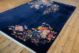 Cobalt blue field with multi-colored Art Deco floral sprays and delicate vinery.