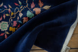 Vintage Art Deco rug with plush cobalt blue pile, vibrant floral detail, and selvage.