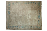 Antique distressed Peking carpet, worn ivory field, blue vine and peacock feather border. 7'11