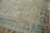 Distressed antique Peking carpet corner with blue vine and peacock feather border, worn field, fringe.