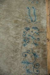 Distressed pile with visible foundation, showing powder blue vines on antique Peking carpet.