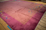 Nichols Art Deco carpet corner with dusty mauve field and pale raspberry floral border.