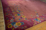 Raspberry border with saffron yellow and sky blue floral sprays on a Nichols Art Deco carpet.