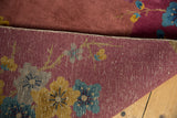 Hand-knotted foundation weave and soft pile texture in dusty mauve with blue floral details.
