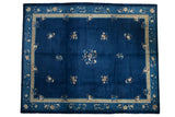Circa 1920s Vintage Peking Carpet, cobalt blue field with multi-color floral sprays and a beige outlined border.