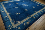 Vintage Peking carpet corner with cobalt blue field, framed by floral beige and blue borders.