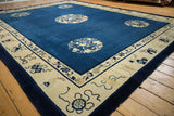 Finely detailed Taoist symbolism on beige border of antique Peking carpet.