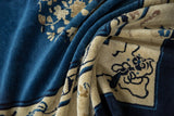 Antique Peking carpet's short pile showing indigo field and stylized ivory cloud bands.