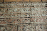 Distressed Oushak carpet, thick pile worn to knot heads, with beige and dusty rose.