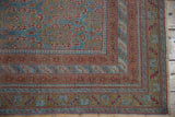 Distressed Afshar rug corner detailing serrated leaf borders in ocean blue, terracotta.