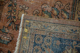 Vintage Mahal carpet detail: fringe, secured selvage, folded back, showing foundation and tags.