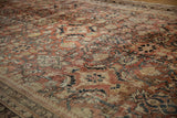 Distressed vintage Mahal rug, showing low pile, worn Herati design, and faded brick tones.