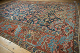 Antique Persian Gorevan carpet corner displays the brick red meandering vine border and blue floral vinery.