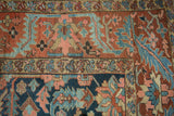 Antique Gorevan carpet detail: brick red field with geometric vinery and meandering blue border.