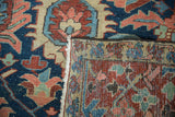 Close-up of Antique Gorevan carpet's geometric patterns in blue, red, and beige, with woven foundation.