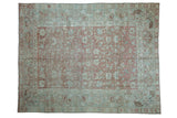 Distressed Malayer rug featuring a dusty rose allover floral field with pale seafoam green border, 7'2