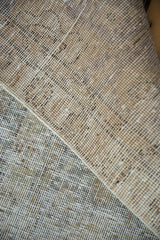 Visible foundation and wear across knot heads on a distressed vintage Meshed carpet.
