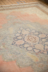 A distressed Kayseri carpet with faded rose and denim blue palmette details.