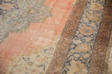 Time-softened pink and denim blue palette with intricate palmettes and floral border.