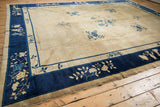 Vintage Peking carpet corner: cobalt blue border, antique ivory floral vines.