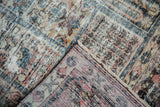 Distressed pile showing foundation threads, revealing the reverse side of the vintage Baktiari.