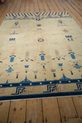 Antique Ningxia carpet border with blue pearled band, geometric fretwork, and field motifs.