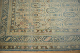 Corner detail showing the layered borders and time-softened boteh paisley of a Sivas rug.