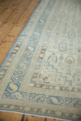 Angled view of a vintage Sivas rug showing the soft texture of its low pile and detailed border.